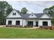 Beautiful new single-story home with white siding, stone accents, and a well-manicured lawn at 490 Benson Meadows Dr, Dallas, GA 30157
