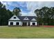 Charming single-story white farmhouse with black shutters and a lush green lawn at 490 Benson Meadows Dr, Dallas, GA 30157