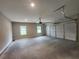 Spacious two-car garage with room for vehicles and storage at 490 Benson Meadows Dr, Dallas, GA 30157