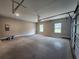 Spacious two car garage with large cement floor, side windows and automatic door at 490 Benson Meadows Dr, Dallas, GA 30157