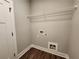 Laundry room with washer and dryer hookups and wire shelving at 490 Benson Meadows Dr, Dallas, GA 30157