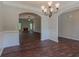 Open-concept living area with hardwood floors, fireplace, and arched doorways at 490 Benson Meadows Dr, Dallas, GA 30157