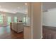 Open-concept living space with stone fireplace, wood-look floors, and modern fixtures at 490 Benson Meadows Dr, Dallas, GA 30157