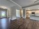 Open-concept living space with hardwood floors, white trim, and natural light from large windows at 490 Benson Meadows Dr, Dallas, GA 30157