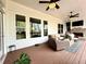 A comfortable outdoor living space featuring ceiling fans, nice furniture, and a cozy fireplace at 305 Red Gate Ln, Canton, GA 30115