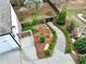 Aerial view of the manicured back yard with stone stairway, fence, and tasteful plantings at 305 Red Gate Ln, Canton, GA 30115