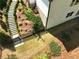 Backyard with stone stairs, wooden fence, and manicured grass, offering a private outdoor retreat at 305 Red Gate Ln, Canton, GA 30115