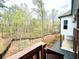 A beautifully landscaped backyard with mature trees and a classic wooden fence at 305 Red Gate Ln, Canton, GA 30115