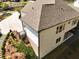 Aerial view of a backyard featuring terraced landscaping, concrete driveway, and outdoor living space at 305 Red Gate Ln, Canton, GA 30115