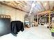 Unfinished basement with concrete walls, exposed insulation, and exposed wood framing at 305 Red Gate Ln, Canton, GA 30115