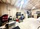 Unfinished basement with exposed insulation, concrete floor, and some storage items at 305 Red Gate Ln, Canton, GA 30115