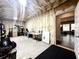 View of the unfinished basement featuring exposed insulation and a doorway leading to another finished room at 305 Red Gate Ln, Canton, GA 30115