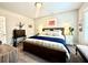 Bright bedroom showcasing a comfortable bed, neutral walls, and modern decor at 305 Red Gate Ln, Canton, GA 30115