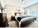 Comfortable bedroom featuring a wood bed frame, soft carpet, and natural light from the window at 305 Red Gate Ln, Canton, GA 30115