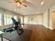 Bright bonus room with hardwood floors, natural light, and versatile space for recreation or hobbies at 305 Red Gate Ln, Canton, GA 30115