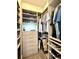 Custom closet with well-organized storage, including shelves, drawers, and hanging rods at 305 Red Gate Ln, Canton, GA 30115