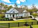 Charming single-story home featuring a welcoming front porch and professionally landscaped front yard at 305 Red Gate Ln, Canton, GA 30115
