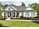 Charming craftsman-style home with a welcoming front porch and beautifully landscaped front yard at 305 Red Gate Ln, Canton, GA 30115