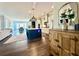 The kitchen features a large island, stainless steel appliances, and open access to the living and dining areas at 305 Red Gate Ln, Canton, GA 30115