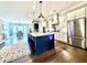 Bright kitchen featuring white cabinets, granite countertops, stainless steel appliances, and an island with seating at 305 Red Gate Ln, Canton, GA 30115