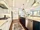 Bright kitchen featuring white cabinets, granite countertops, stainless steel appliances, and an island with seating at 305 Red Gate Ln, Canton, GA 30115