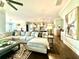 Open concept living room featuring dark hardwood floors and seamless connection to the kitchen and dining area at 305 Red Gate Ln, Canton, GA 30115