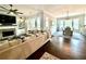 Open-concept living space with hardwood floors, large windows, and a fireplace at 305 Red Gate Ln, Canton, GA 30115