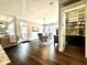 Open-concept living space showcasing hardwood floors, a dining area, and a cozy living room with natural light at 305 Red Gate Ln, Canton, GA 30115