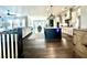 Spacious open-concept living area with hardwood floors, large windows, and modern kitchen island at 305 Red Gate Ln, Canton, GA 30115
