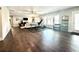Expansive living area with hardwood floors, neutral decor, and an exercise area at 305 Red Gate Ln, Canton, GA 30115