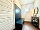 Inviting mudroom features custom bench seating, coat hooks, shoe storage, and hardwood floors at 305 Red Gate Ln, Canton, GA 30115