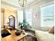 Well-lit office space with large windows, neutral tones, a day bed, and stylish light fixture at 305 Red Gate Ln, Canton, GA 30115