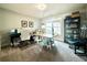 Spacious home office featuring natural light, built in bookcase, and ample workspace at 305 Red Gate Ln, Canton, GA 30115