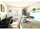 Spacious home office with modern desk and decor, built-in bookcase, and natural light at 305 Red Gate Ln, Canton, GA 30115