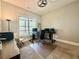 Office with modern black desk, two monitors, and a clear view of the wooded back yard at 305 Red Gate Ln, Canton, GA 30115