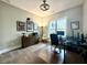 Bright office with a desk, three monitors, and a view to the treeline at 305 Red Gate Ln, Canton, GA 30115