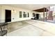 Spacious covered patio featuring a seating area, views of the backyard, and access to the lower level at 305 Red Gate Ln, Canton, GA 30115