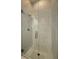 The stand up shower has glass doors and nice patterned tile at 305 Red Gate Ln, Canton, GA 30115