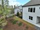 View of landscaped back yard with fence, patio, and well-manicured lawn at 305 Red Gate Ln, Canton, GA 30115
