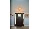 Elegant entryway featuring a stylish light fixture, attractive front door, and tasteful decor at 3440 Camelot Way, Loganville, GA 30052