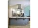Well-designed kitchen with a large island, modern appliances, and ample counter space at 3440 Camelot Way, Loganville, GA 30052