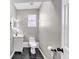 Bathroom with modern black tile flooring, updated vanity, and lighting at 3690 Darrah Sw Way, Atlanta, GA 30331