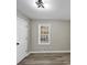 Cozy bedroom with natural light and modern light fixture at 3690 Darrah Sw Way, Atlanta, GA 30331