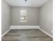 Bedroom featuring wood-look flooring and natural light from the window at 3690 Darrah Sw Way, Atlanta, GA 30331