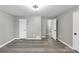 Spacious bedroom featuring wood-look flooring and neutral gray walls at 3690 Darrah Sw Way, Atlanta, GA 30331