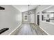 Dining area featuring contemporary chandelier, ample space, and an open view to the bright kitchen at 3690 Darrah Sw Way, Atlanta, GA 30331