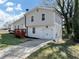 View of the home's exterior with a driveway leading to an attached garage at 3690 Darrah Sw Way, Atlanta, GA 30331