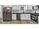 Bright kitchen with stainless steel appliances, white cabinets, and modern countertops at 3690 Darrah Sw Way, Atlanta, GA 30331