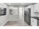 Open concept kitchen with stainless steel refrigerator and modern finishes at 3690 Darrah Sw Way, Atlanta, GA 30331