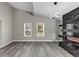 Bright living room featuring high ceilings, a fireplace, and large windows offering plenty of natural light at 3690 Darrah Sw Way, Atlanta, GA 30331